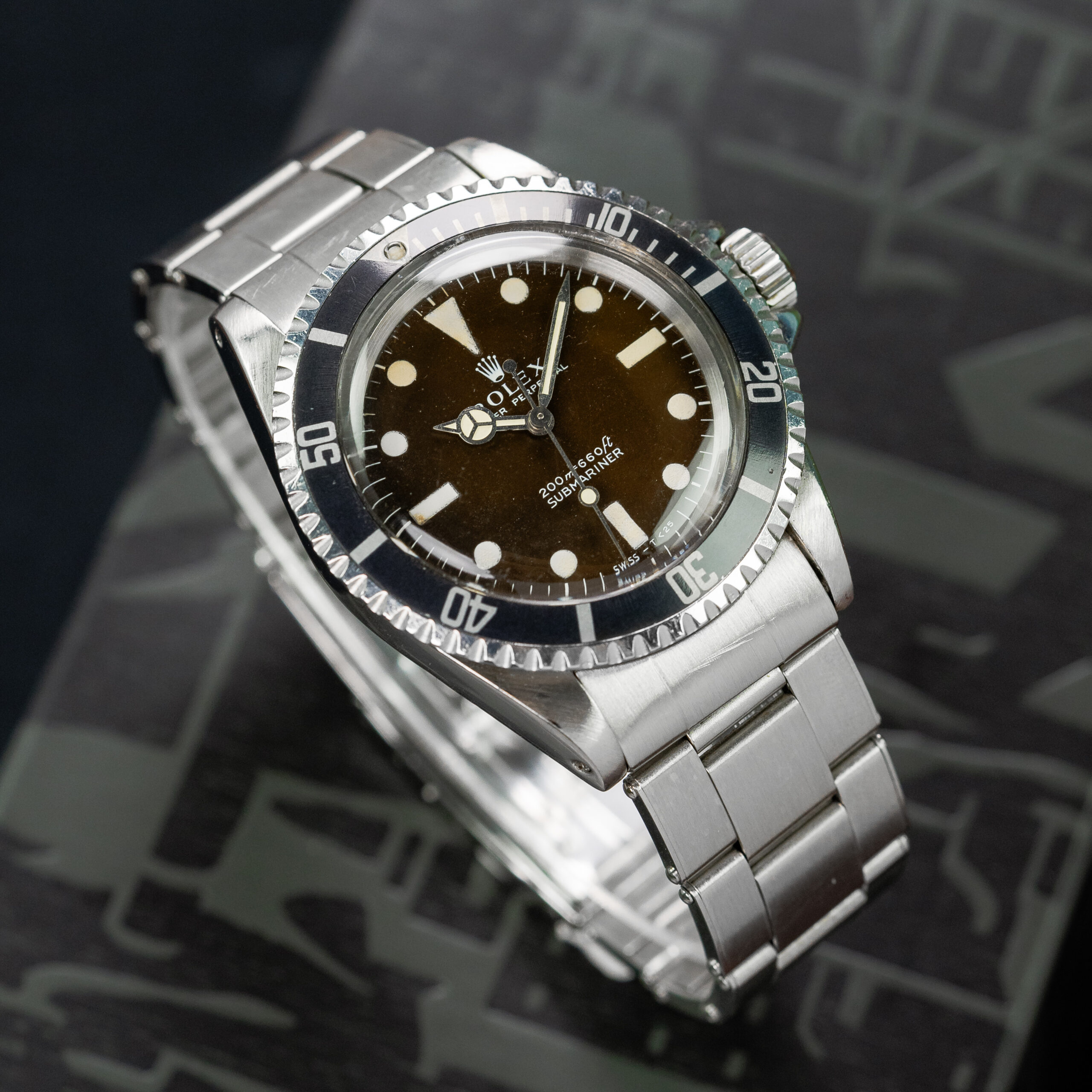 Rolex 5513 — Tropical Matte Dial, Meters First. Photographed dealer specimen. Documented example: 1968. Production span has not been established. · Photo: Amsterdam Vintage Watches · © Amsterdam Vintage Watches, used with permission · Source: https://amsterdamvintagewatches.com/shop/rolex-submariner-5513-tropical-meter-first/